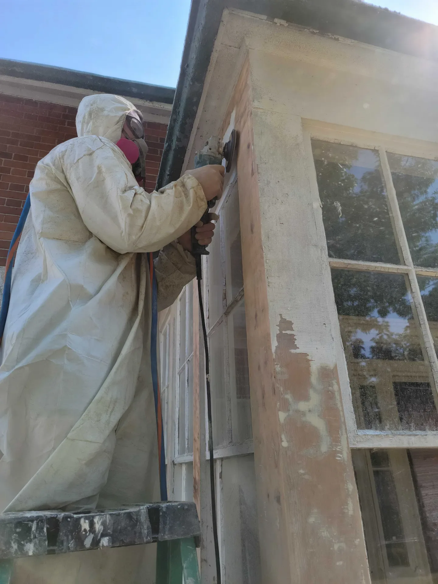 Heritage window restoration on a historic Cobourg building by Cobourg Construction